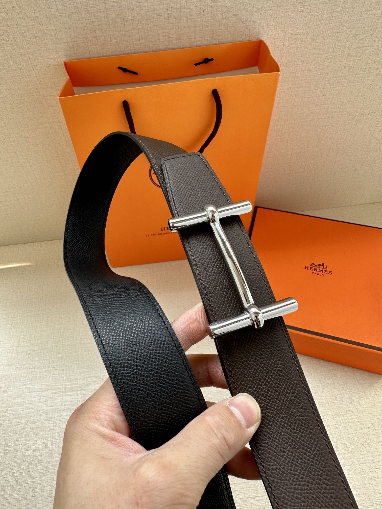 Hermes belt dark textured leather, silver buckle with two long bars.