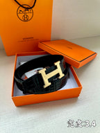 Hermes belt in dark embossed leather with gold-tone H buckle in gift box