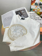 Versace white sweatshirt with gold Medusa face graphic on chest
