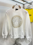Versace white crewneck sweatshirt with gold Medusa face emblem on chest