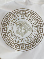 White crewneck sweatshirt with gold bead medallion lion logo print