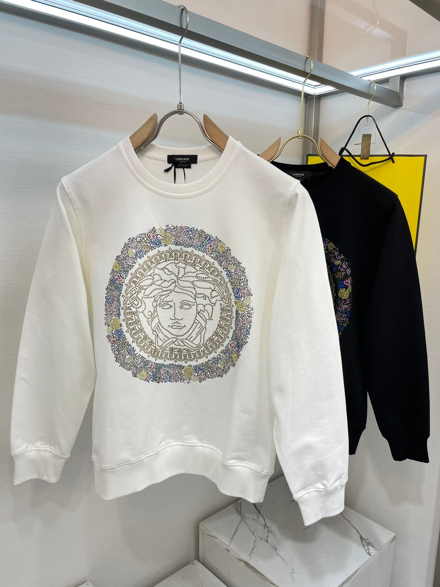 Versace white sweatshirt with multicolor Medusa medallion graphic on chest