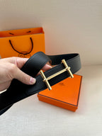 Hermes black leather belt with gold-tone buckle and textured strap