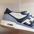 Fendi unisex sneaker upper close-up with light gray suede, white leather, navy accents