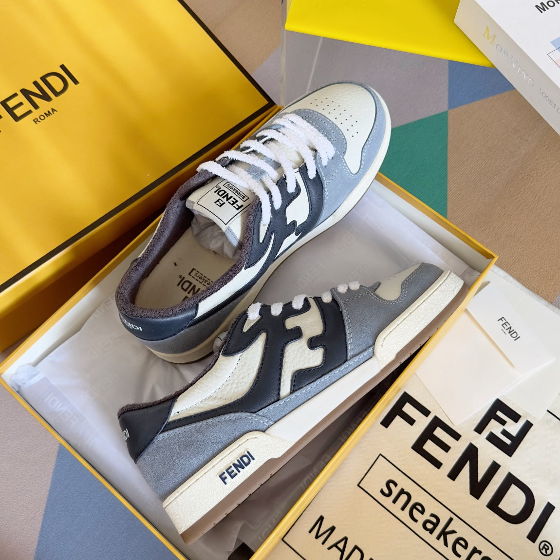 Fendi unisex lace-up sneakers in light gray, white, and dark navy with logo detail