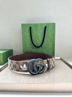 Gucci belt on box: beige GG canvas band with dark brown leather strap edge