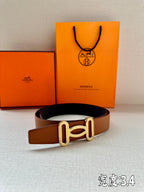 Tan leather belt with gold-tone H buckle