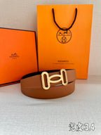 Tan leather belt with gold-tone H buckle, flat front view