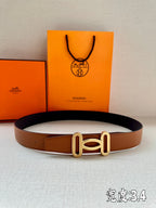 Tan leather belt with gold-tone H buckle