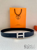 Dark blue leather belt with silver Hermès H buckle and punched adjustment holes