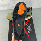 Air Jordan 4 sneaker outsole with orange traction section and dark gray tread