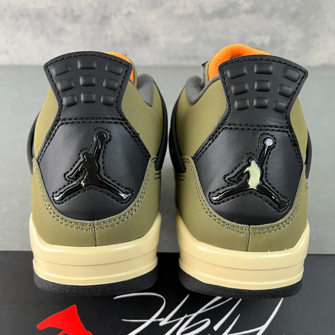 Air Jordan 4 sneakers, back view with black heel, olive sides, and orange ankle lining