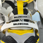 Balenciaga sneakers back view with yellow strap and BALENCIAGA lettering