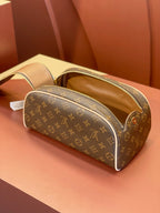 Louis Vuitton monogram toiletry bag with open top lining and zip closure