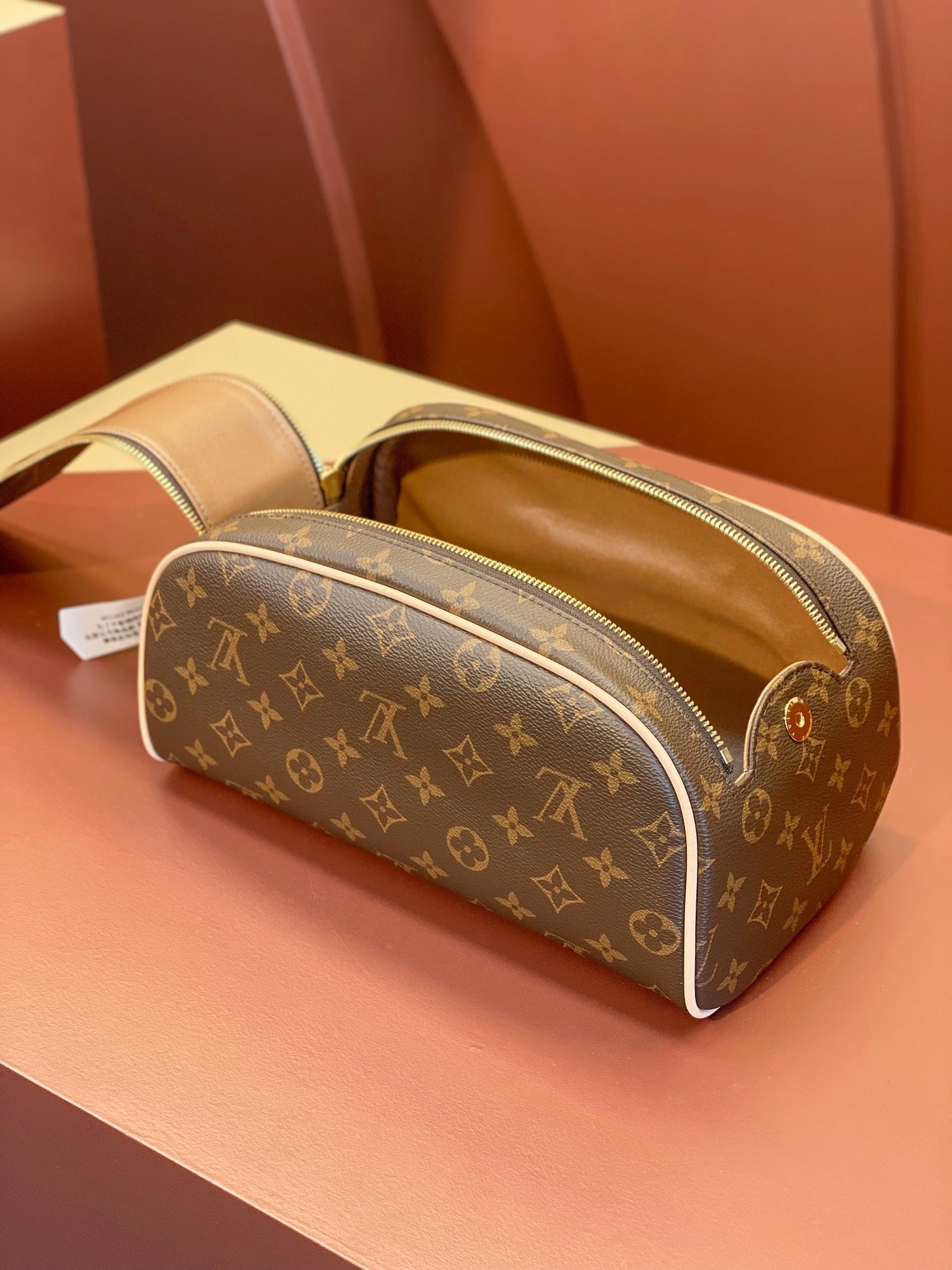 Louis Vuitton monogram toiletry bag with open top lining and zip closure