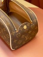 Louis Vuitton monogram toiletry bag interior view through the open top