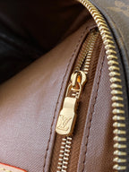 Louis Vuitton monogram zip pull on brown lining with gold zipper hardware