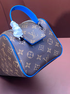 Louis Vuitton mini monogram bag with blue handle and zipper pull detail