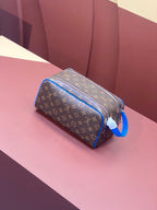Louis Vuitton monogram toiletry bag with blue leather trim and zippered opening