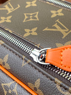 Louis Vuitton monogram bag zipper with orange leather pull and silver hardware