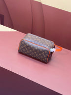 Louis Vuitton monogram crossbody bag, orange strap, top zip closure