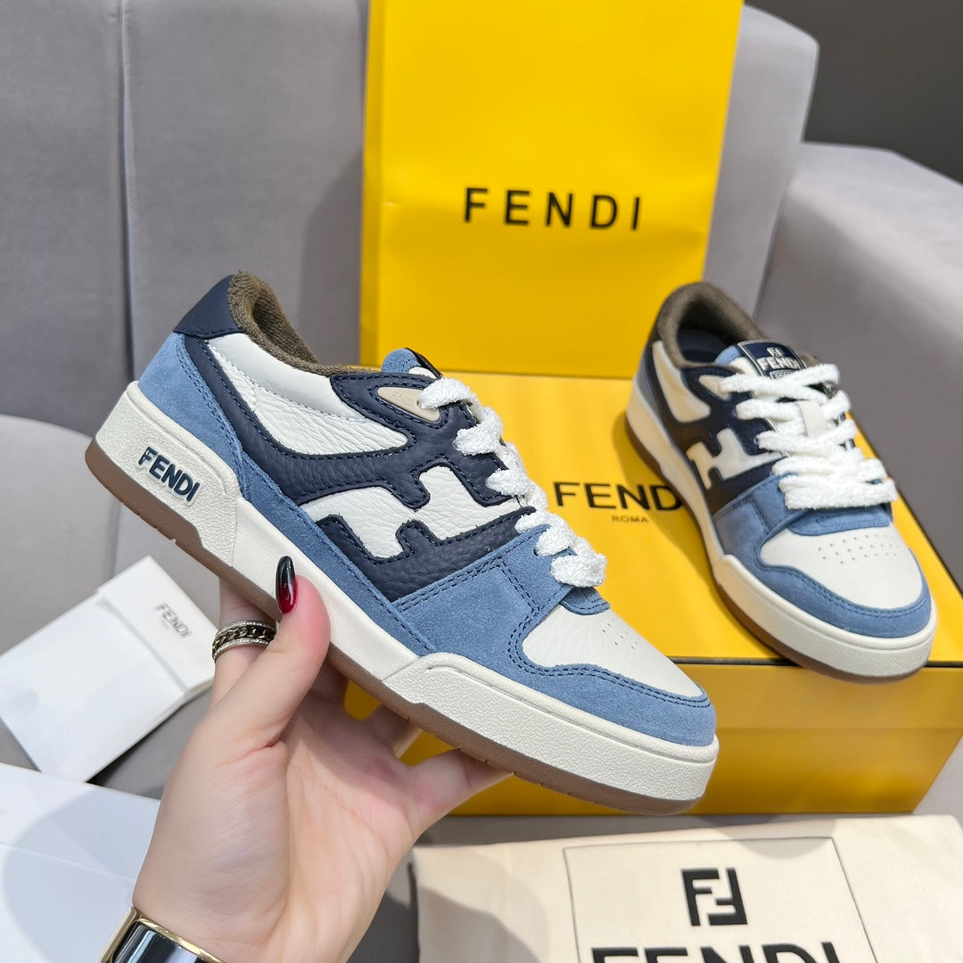 Fendi sneakers in blue and white with lace-up design and padded tongue; side view