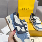 Fendi sneakers close-up: blue and white uppers with Fendi logo detail on side