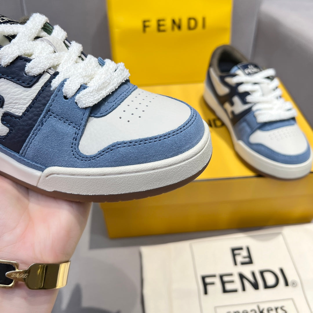 Fendi sneakers close-up: blue leather panels, white overlays, and textured white lace trim