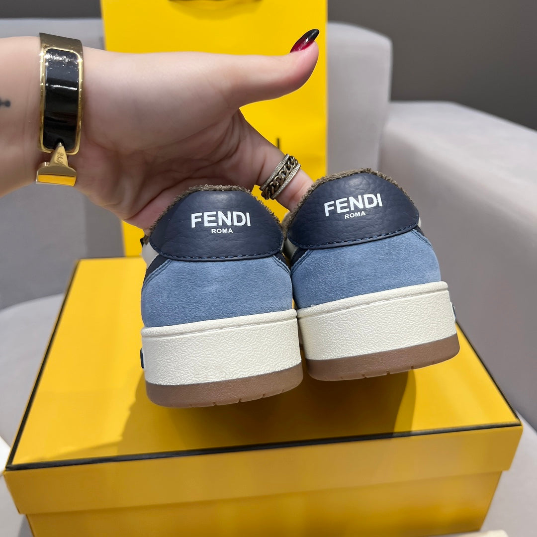 Fendi sneakers with blue suede uppers and white rubber sole; heel view with logos
