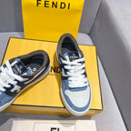 Fendi sneakers in blue and white with white laces and dark tongue logo; angled view