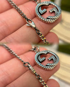 Silver-toned chain necklace with enamel GG heart pendant and gold accents