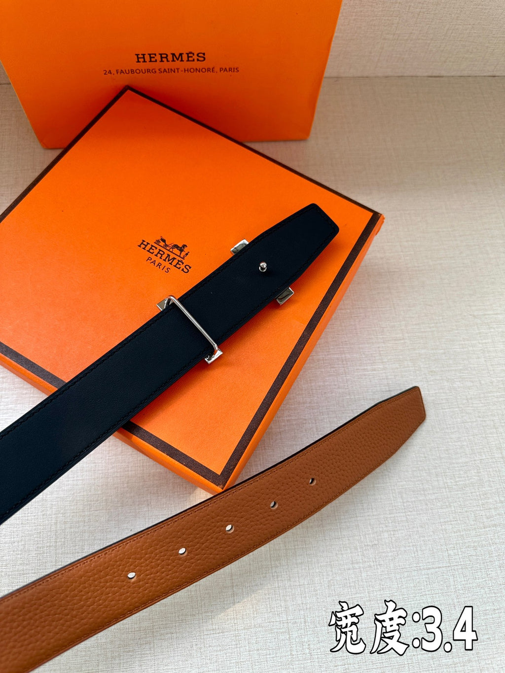 Hermes leather belt with dark navy strap and silver-tone buckle