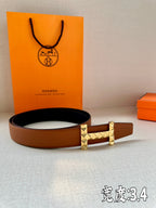 Hermes leather belt with tan-brown strap and gold-tone square stud buckle