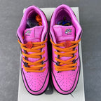 Pink low-top sneakers front view with orange laces and purple interior lining