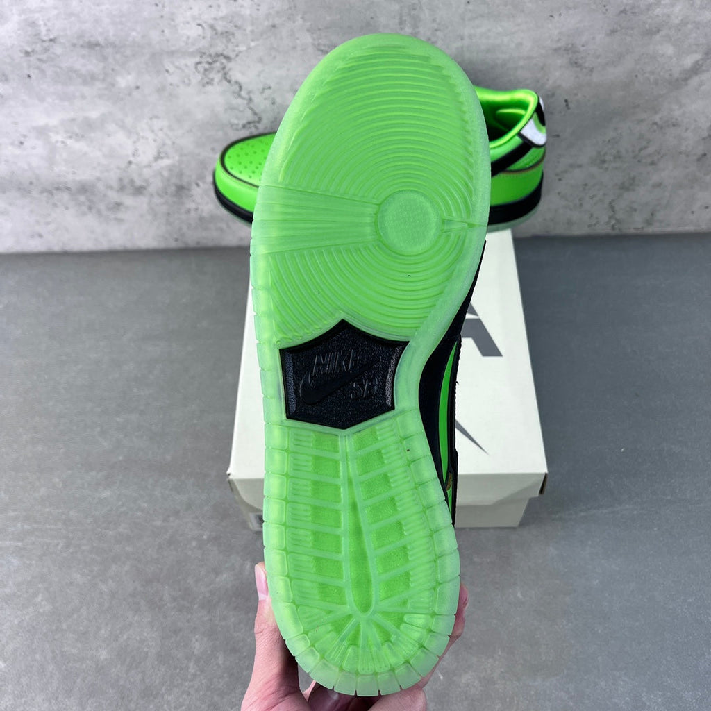 Neon green sneaker outsole and heel with tread pattern and black heel label
