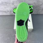 Neon green sneaker outsole and heel with tread pattern and black heel label