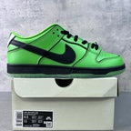 Low-top sneakers in neon green with black Swoosh and lace-up front