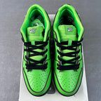 Pair of neon green sneakers with black laces and embroidered tongue tabs