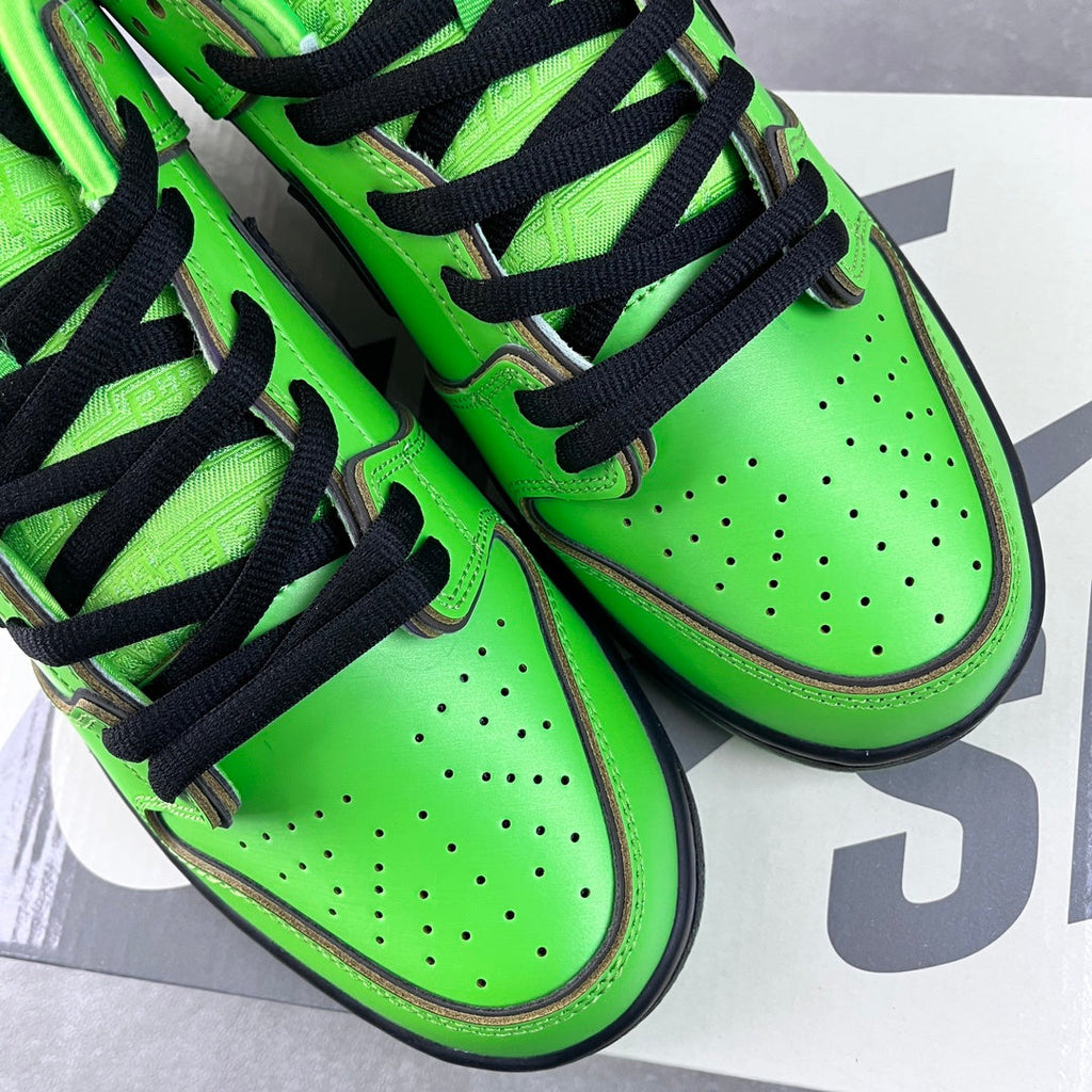 Neon green sneakers with black laces and perforated toe boxes, side close-up
