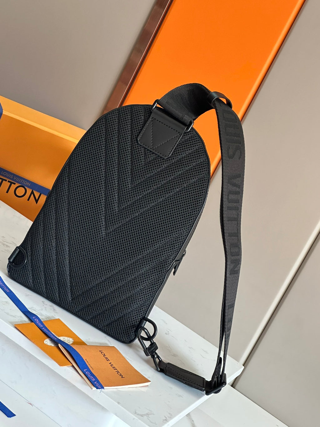 Louis Vuitton mini backpack in dark textured leather with flap front, top handle, and straps