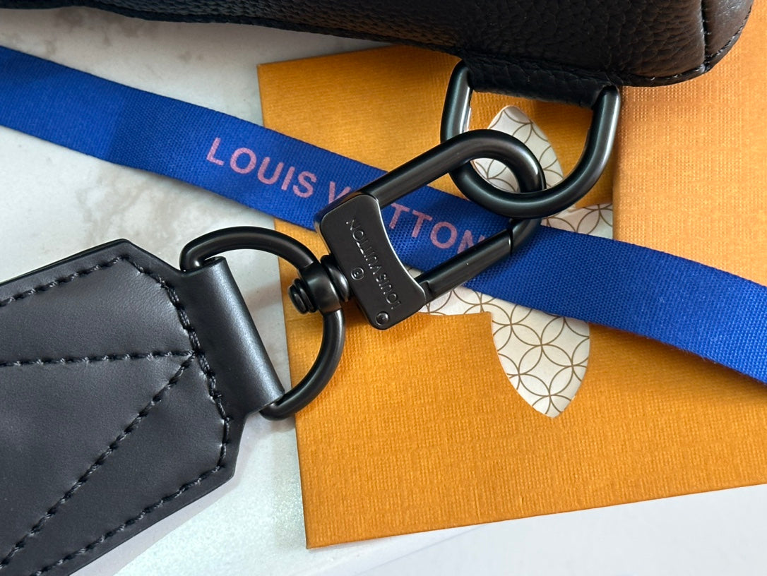 Louis Vuitton bag with blue webbing strap and metal D-rings and clasp
