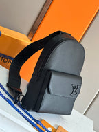 Louis Vuitton mini backpack-style bag in dark textured leather with front pocket and LV emblem