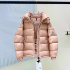 Moncler light pink hooded puffer jacket with full zipper and embroidered chest badge