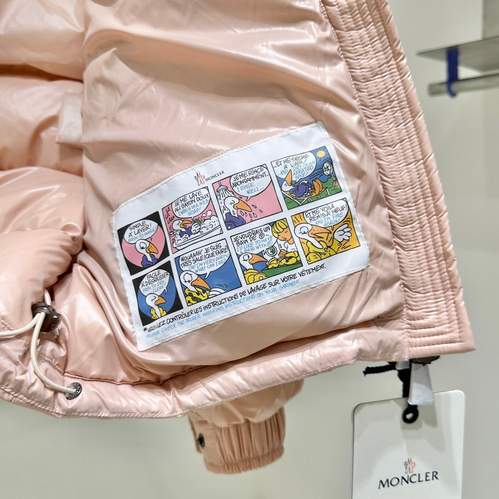 Moncler light pink puffer jacket sleeve lining with colorful printed graphic patch