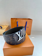 Louis Vuitton monogram belt in dark brown with gold-tone LV buckle and olive lining