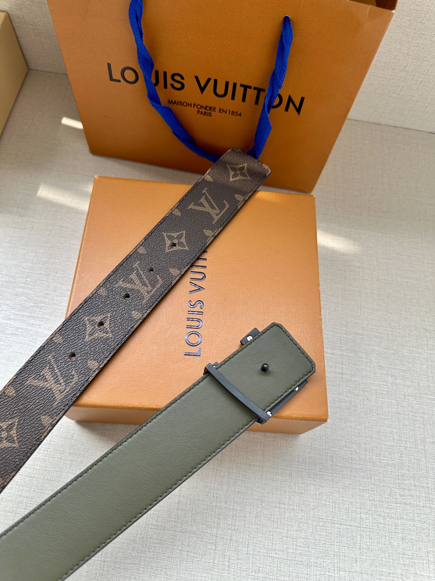 Louis Vuitton monogram belt with gold-tone LV buckle and olive leather strap
