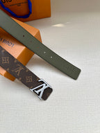 Louis Vuitton monogram belt with gold-tone LV buckle beside plain olive belt