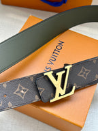 Louis Vuitton monogram belt close-up with gold-tone LV buckle on dark brown strap