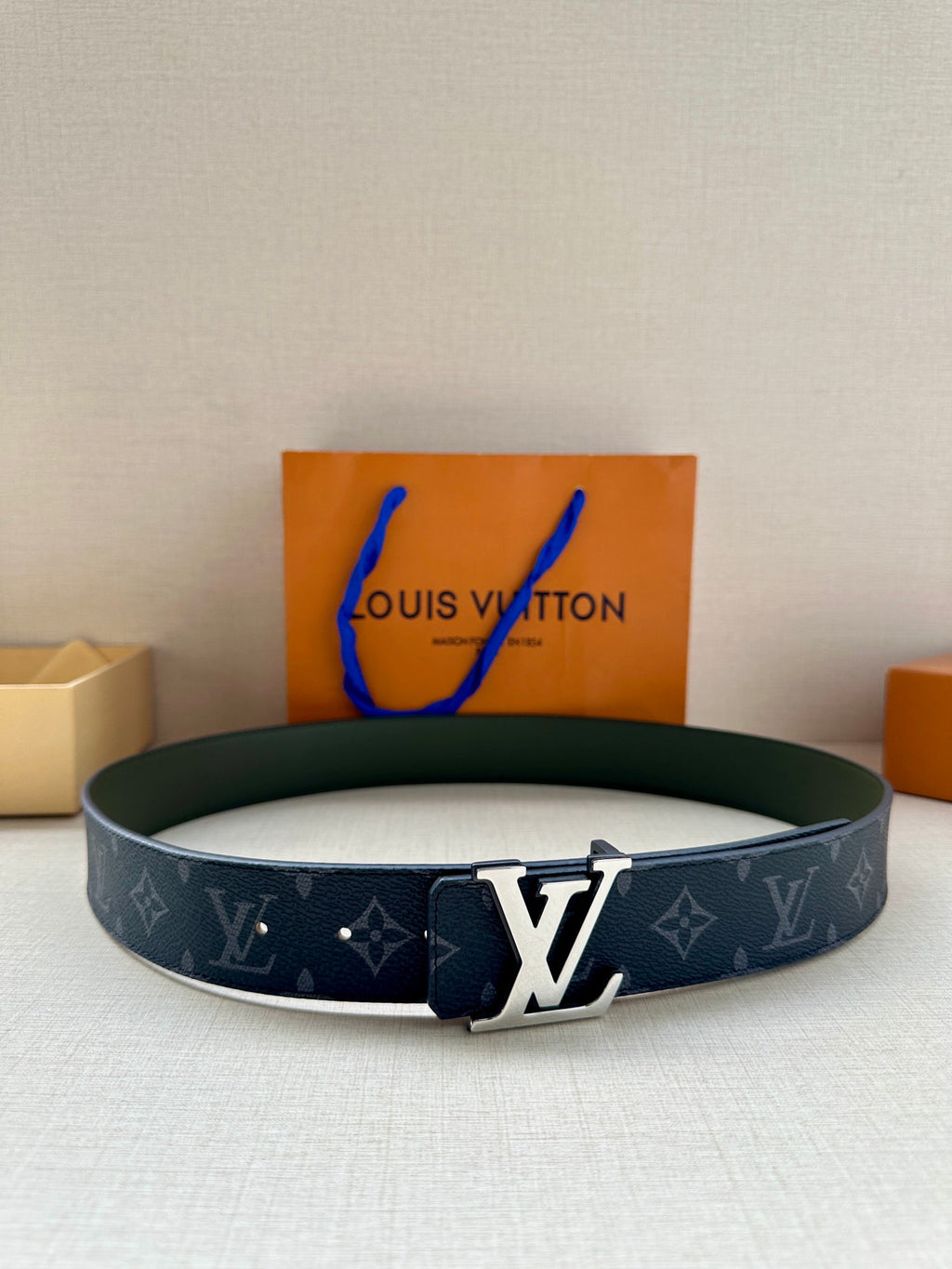 Louis Vuitton monogram belt with LV gold-tone buckle, dark blue strap and green lining