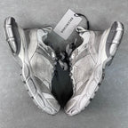 Pair of light gray Balenciaga sneakers with suede and mesh panels, lace-up design
